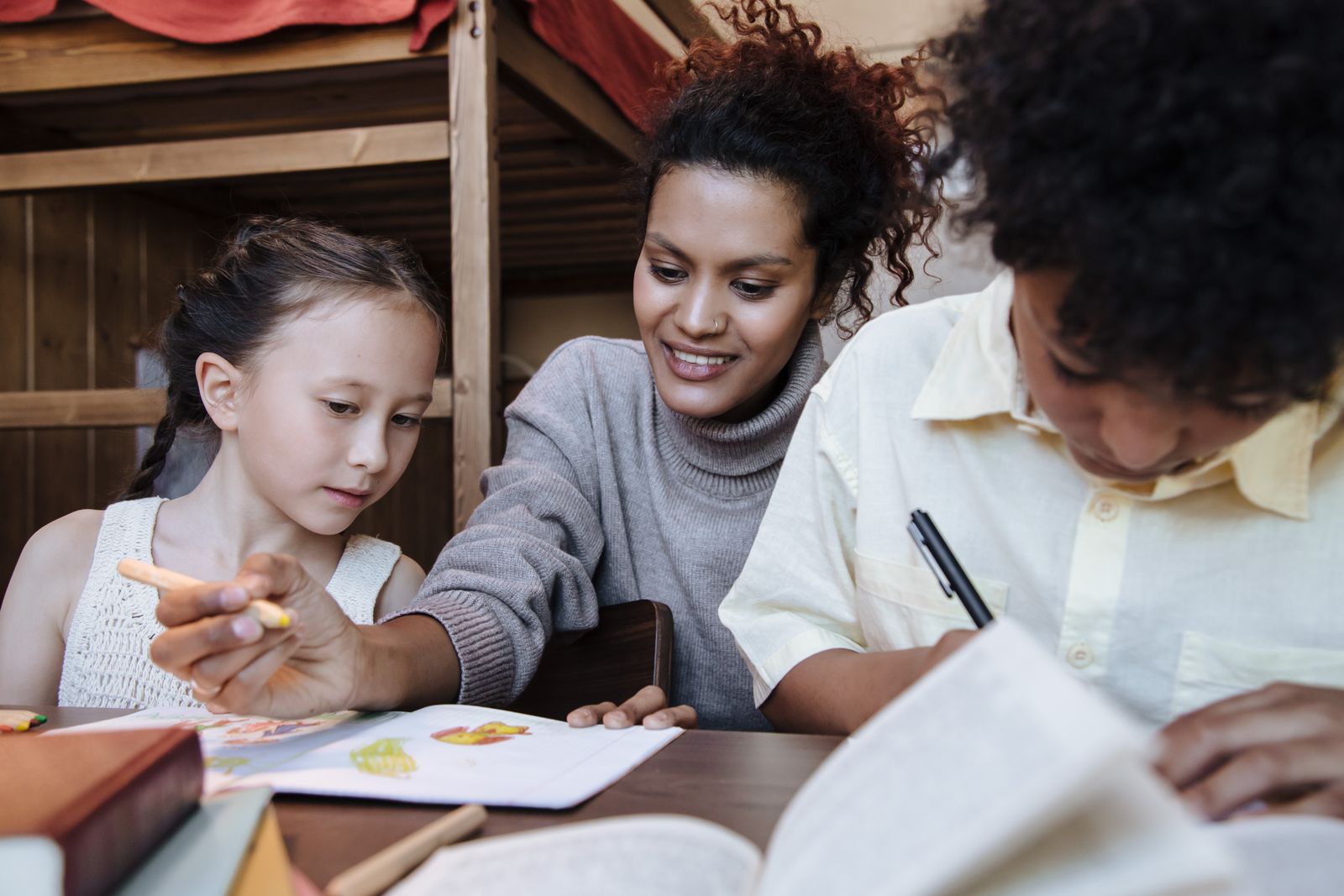Children enjoying creative play with a caring adult